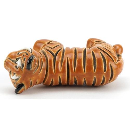 1298 - Mid century style stylised pottery tiger, incised marks to the base, 13.5cm in length