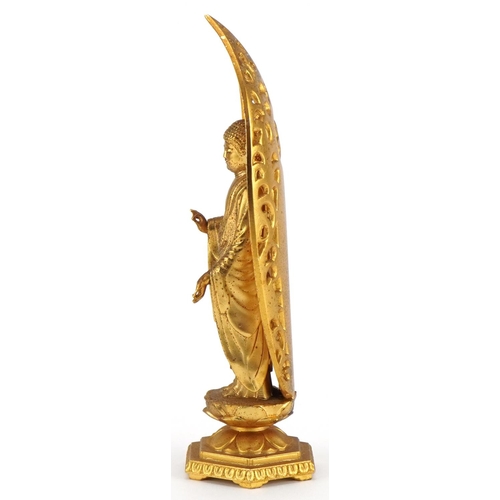 523 - Japanese gilt bronze figure of Amida Nyorai Buddha, character marks to the reverse, 16cm high