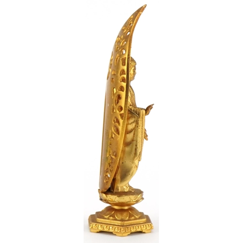 523 - Japanese gilt bronze figure of Amida Nyorai Buddha, character marks to the reverse, 16cm high