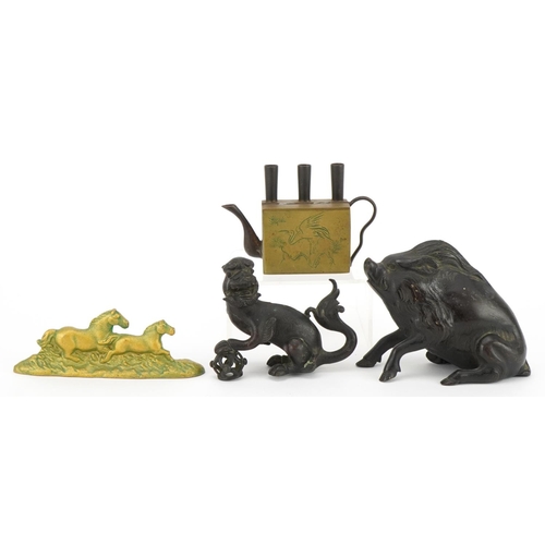 521 - Chinese metalware including a patinated bronze Foo dog and brass teapot, the largest 13cm in length