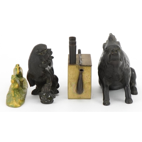 521 - Chinese metalware including a patinated bronze Foo dog and brass teapot, the largest 13cm in length