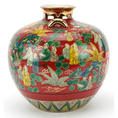 1530 - Japanese Kutani porcelain vase with twin handles decorated with elders in a landscape, 23cm high