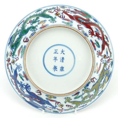 1765 - Chinese porcelain doucai dish hand painted with dragons amongst clouds, six figure character marks t... 