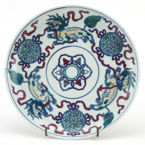 58 - Chinese porcelain doucai dish hand painted with qilins, six figure character marks to the reverse, 2... 