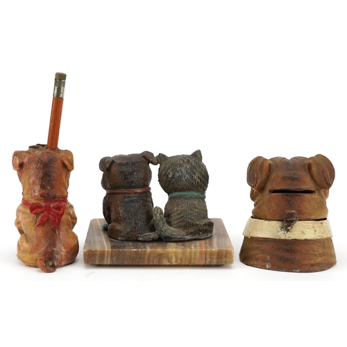 87 - Cold painted Bulldogs including inkwell and pencil holder, the largest 11cm wide