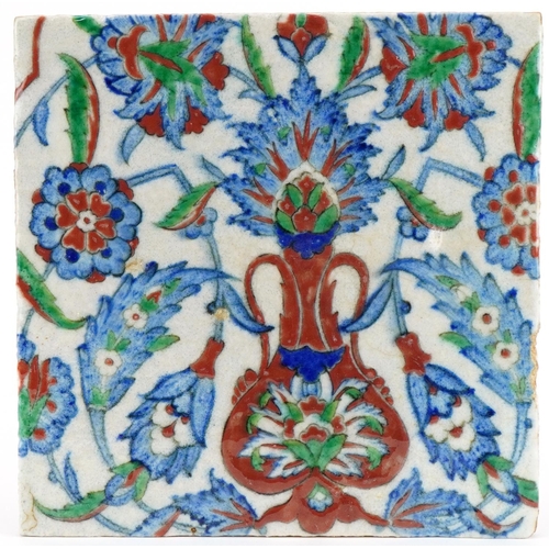 266 - Square Islamic pottery tile hand painted with stylised flowers and foliage, 24.5cm x 24.5cm