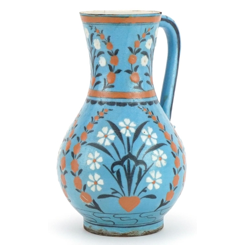 148 - Iznik pottery water jug hand painted with flowers, 24cm high