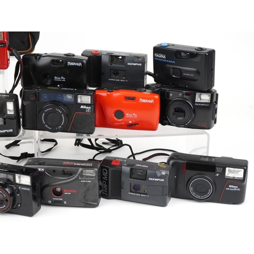 1357 - Collection of vintage film cameras including Canon and Nikon