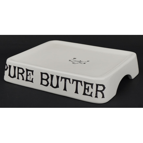 531 - Agricultural interest Pure Butter ceramic stand, 34cm wide