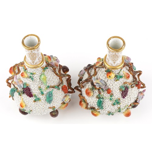 40 - Meissen, large pair of 19th century German floral encrusted bottles with stoppers decorated in relie... 