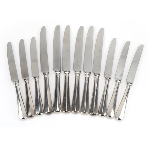 385 - William Bush & Son Ltd, two sets of six silver handled knives, Sheffield 1970, 24cm in length, total... 