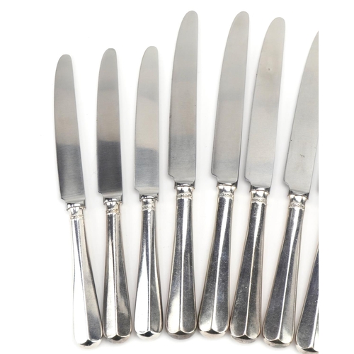 385 - William Bush & Son Ltd, two sets of six silver handled knives, Sheffield 1970, 24cm in length, total... 