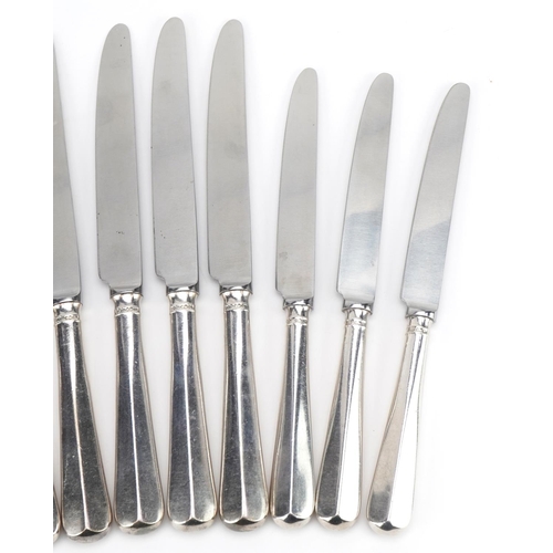 385 - William Bush & Son Ltd, two sets of six silver handled knives, Sheffield 1970, 24cm in length, total... 