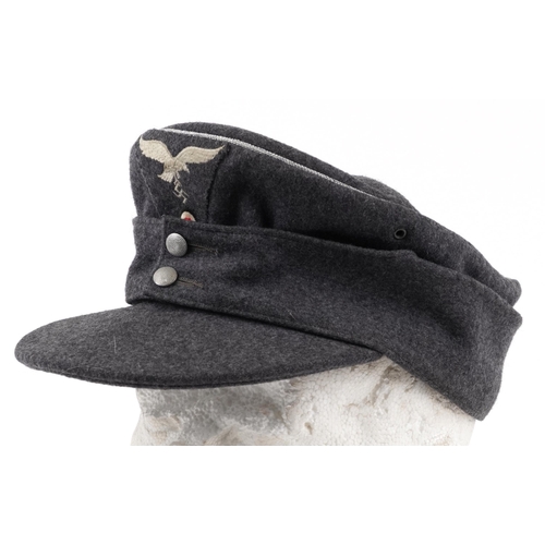 693A - German military World War II interest M43 Luftwaffe officer's cap, dated 1944 to the interior