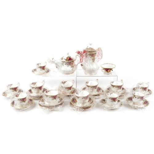 1308 - As new Royal Albert Old Country Roses twelve place tea and coffee service, the coffee pot 20cm high