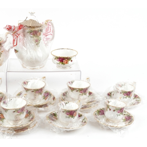 1308 - As new Royal Albert Old Country Roses twelve place tea and coffee service, the coffee pot 20cm high