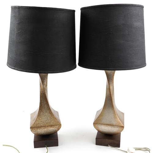 1587 - Pair of contemporary gilt painted twisted table lamps with shades, each 87cm high