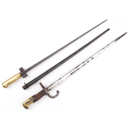 704 - Two military interest bayonets including a French example, 65.5cm in length