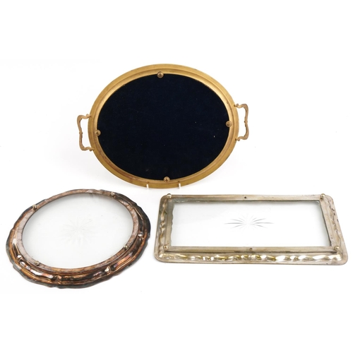 1418 - Three metal and glass trays comprising a good quality French style gilt brass twin handled example a... 