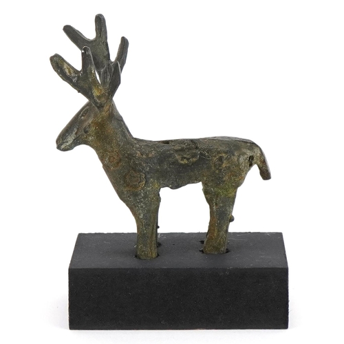 1763 - Greek style bronze figure of a moose on painted stand, overall 11.5cm high