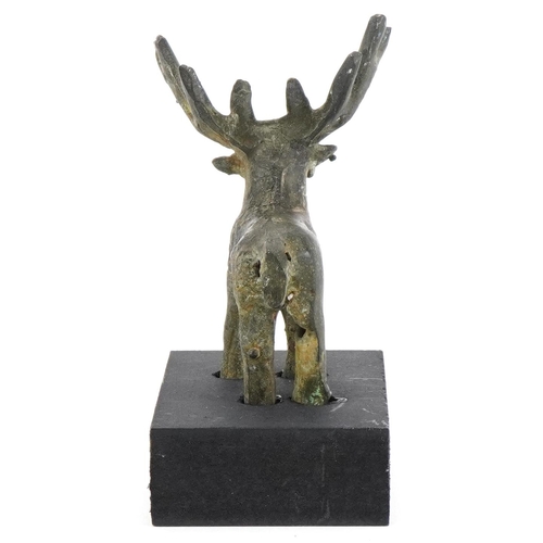 1763 - Greek style bronze figure of a moose on painted stand, overall 11.5cm high