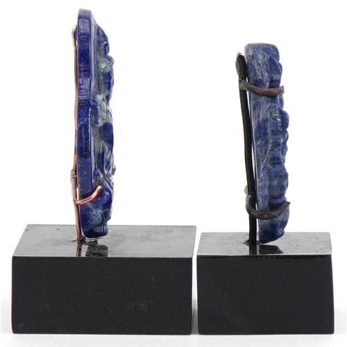 1632 - Two Chinese lapis lazuli panels carved with a figure of Buddha and dragon, each raised on stands, th... 