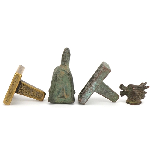 1443 - Chinese bronzes including two seals and an archaic style weight, the largest 6.5cm high