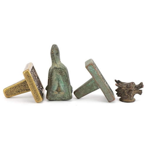 1443 - Chinese bronzes including two seals and an archaic style weight, the largest 6.5cm high