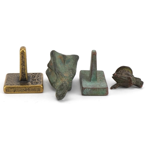 1443 - Chinese bronzes including two seals and an archaic style weight, the largest 6.5cm high