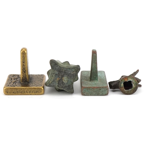 1443 - Chinese bronzes including two seals and an archaic style weight, the largest 6.5cm high