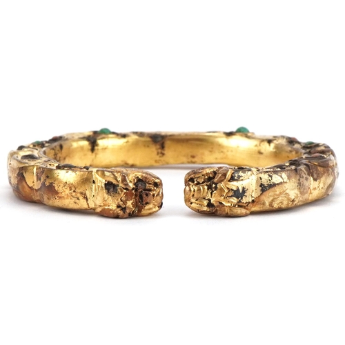 1739 - Tibetan gilt metal dragon bangle, 8cm wide