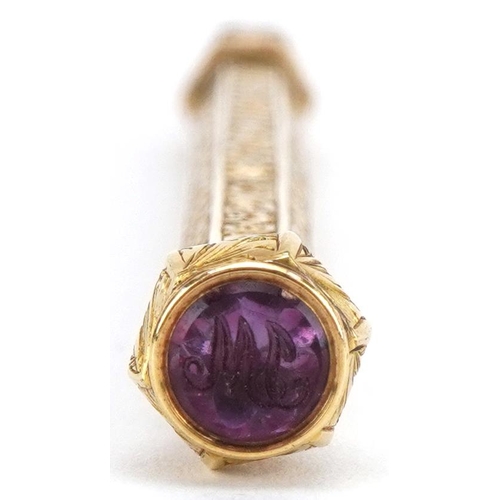 133 - Sampson Mordan & Co, Victorian unmarked gold propelling pencil with floral chased body and amethyst ... 