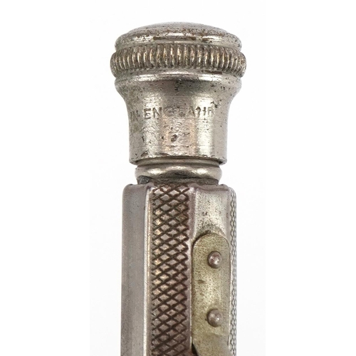 140 - Unmarked silver multi pen with engine turned decoration and a white metal example