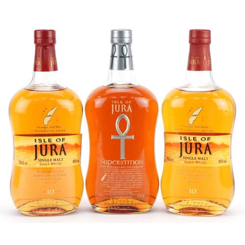 215 - Three bottles of Iles of Jura whisky with boxes comprising two bottles aged 10 years and Rare Aged S... 