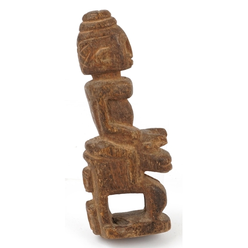 1521 - Tribal interest woodenware including a fertility figure and Aboriginal boomerang, the largest 105cm ... 