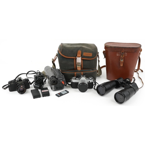 1356 - Cameras and binoculars including a pair of Dollond Owlvis 15 x 60, Canon AE1 and Pentax NV