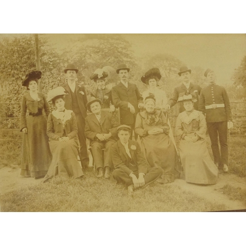 915 - Two Victorian black and white social history photographs including one of a family, mounted, framed ... 