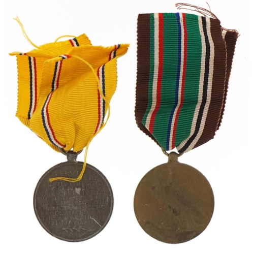 589 - Two American military interest medals comprising European-African-Middle-Eastern Campaign and Defenc... 