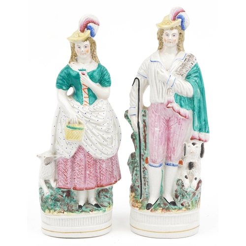 1577 - Pair of Victorian Staffordshire shepherd and shepherdess figures, 33cm high