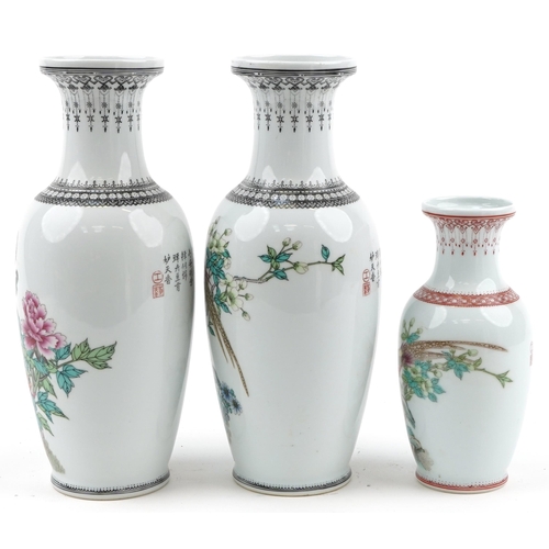 1590 - Three Chinese porcelain baluster vases including a pair, each hand painted with birds amongst flower... 