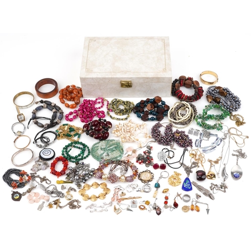 2565 - Vintage and later costume jewellery, some silver, including a Victorian cameo brooch, amber coloured... 