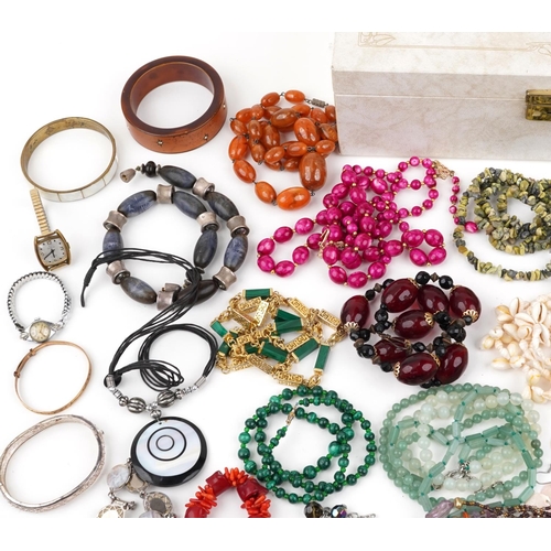 2565 - Vintage and later costume jewellery, some silver, including a Victorian cameo brooch, amber coloured... 