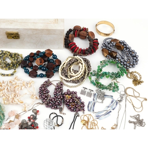 2565 - Vintage and later costume jewellery, some silver, including a Victorian cameo brooch, amber coloured... 