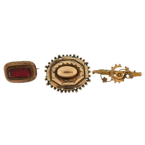 2154 - Three antique brooches including one unmarked 9ct gold set with a red stone and 9ct gold moon crest ... 