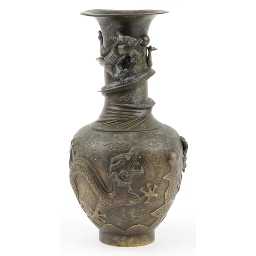 522 - Large Chinese bronze vase decorated in relief with dragons, character marks to the base, 35cm high