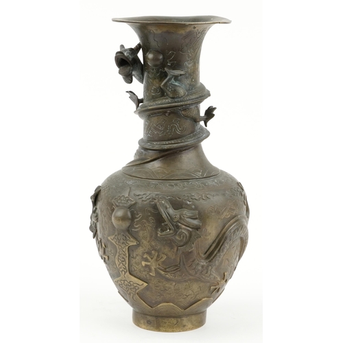 522 - Large Chinese bronze vase decorated in relief with dragons, character marks to the base, 35cm high