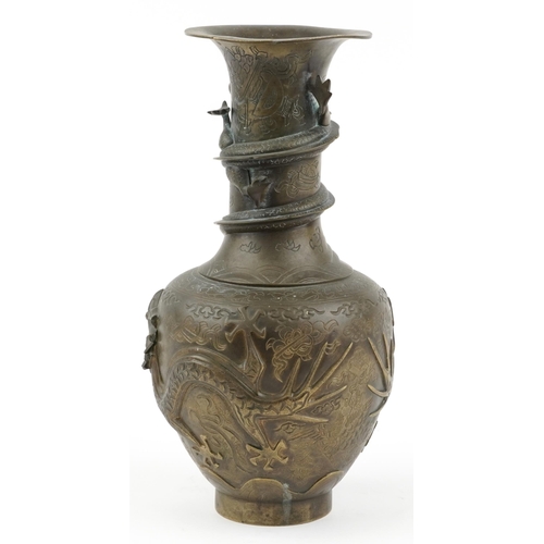 522 - Large Chinese bronze vase decorated in relief with dragons, character marks to the base, 35cm high