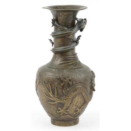 522 - Large Chinese bronze vase decorated in relief with dragons, character marks to the base, 35cm high