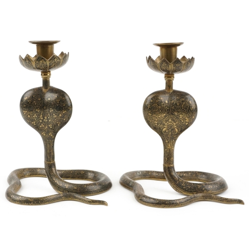 491 - Pair of Indian brass enamelled candlesticks engraved with flowers in the form of serpents, each 21.5... 