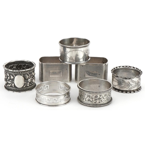 201 - Seven Victorian and later silver napkin rings, various hallmarks, the largest 4.8cm wide, total 162.... 